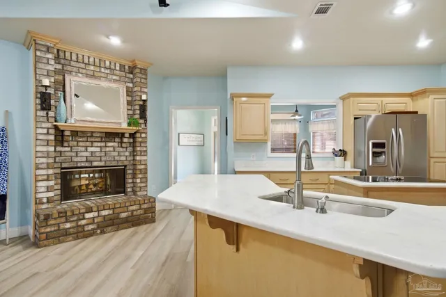 a spacious bathroom with a granite countertop sink a mirror and a shower