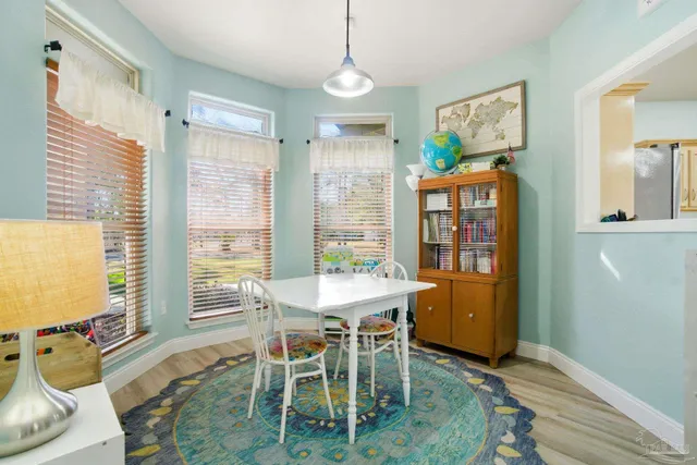 a spacious bedroom with a bed and a flat screen television