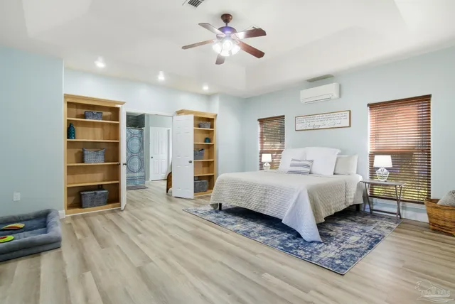 a kitchen with cabinets a stove and a wooden floors