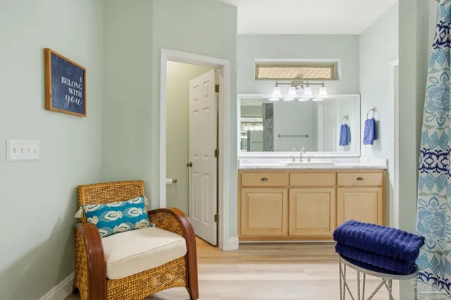 a en suite bathroom with a double vanity sink and a mirror