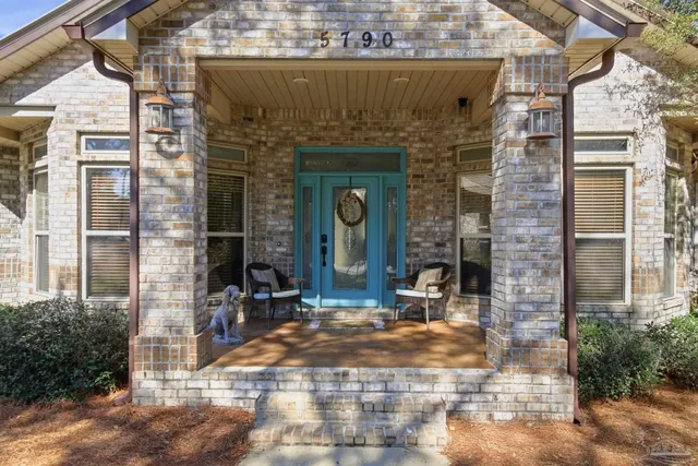 a front view of a building with outdoor seating