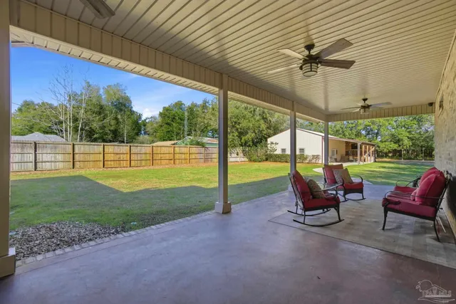 a balcony with table and chairs
