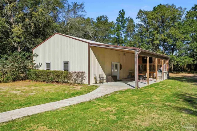 a bedroom with a bed and a chair