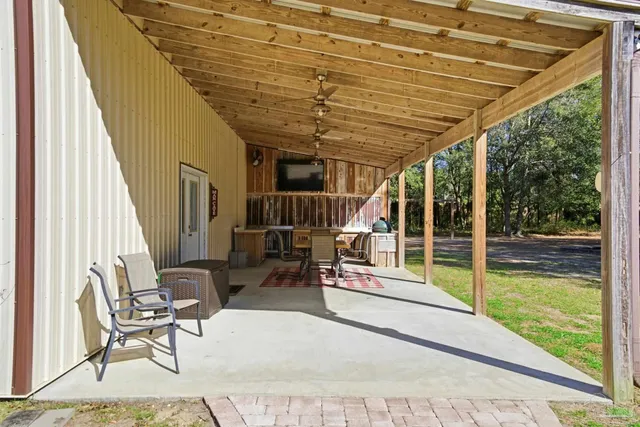 a view of a room with window and wooden floor