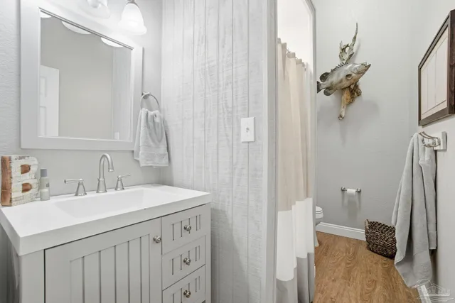 an aerial view of a house with swimming pool and mountains