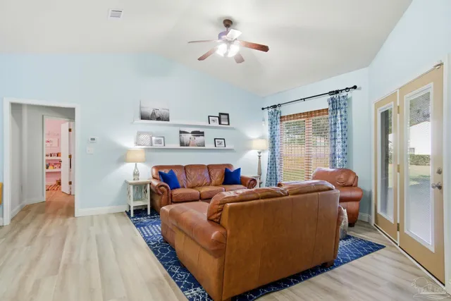 a room with a bed and a chandelier