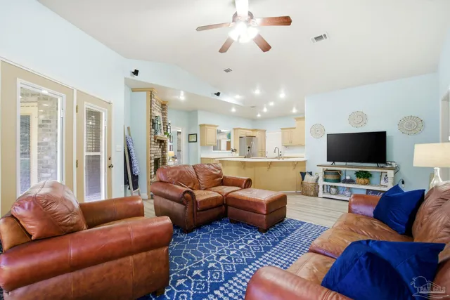 a living room with furniture or couch and a flat screen tv