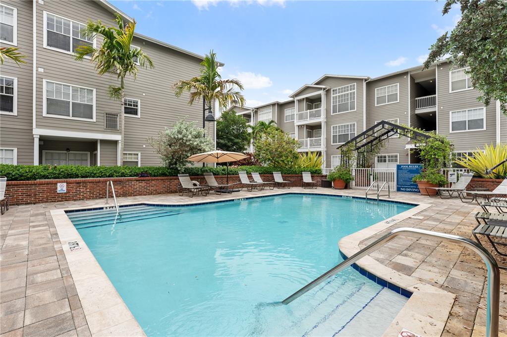 800 South Dakota Avenue, Unit 330 Tampa, FL 33606 - Photo 14 of 25 a front view of building with yard and swimming pool