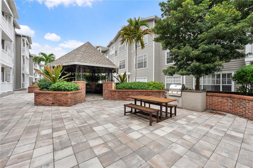 800 South Dakota Avenue, Unit 330 Tampa, FL 33606 - Photo 16 of 25 a view of a patio with a table and chairs
