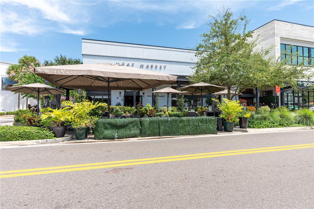 800 South Dakota Avenue, Unit 330 Tampa, FL 33606 - Photo 23 of 25 a front view of a house with a yard and a sitting area