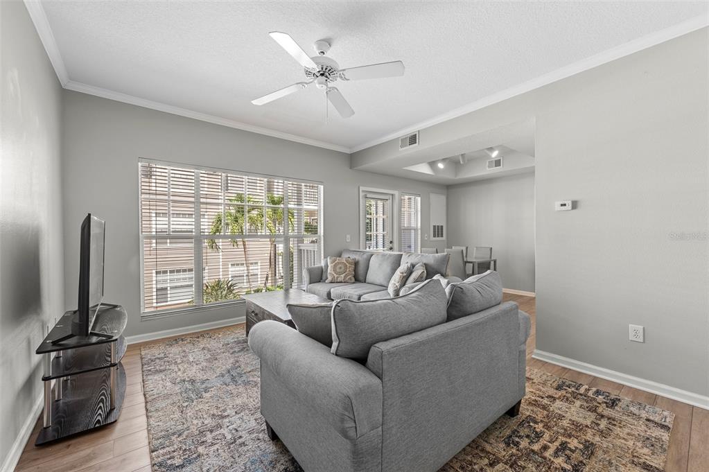 800 South Dakota Avenue, Unit 330 Tampa, FL 33606 - Photo 5 of 25 a living room with furniture and a flat screen tv