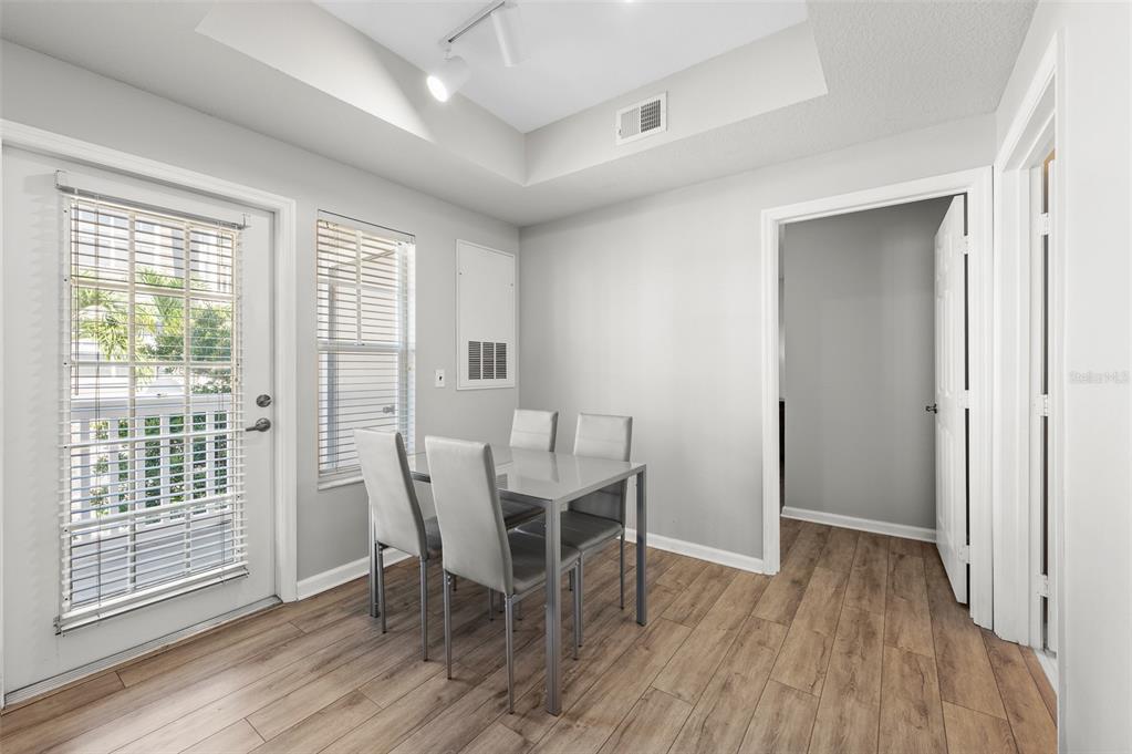 800 South Dakota Avenue, Unit 330 Tampa, FL 33606 - Photo 6 of 25 a view of a dining room with furniture and wooden floor