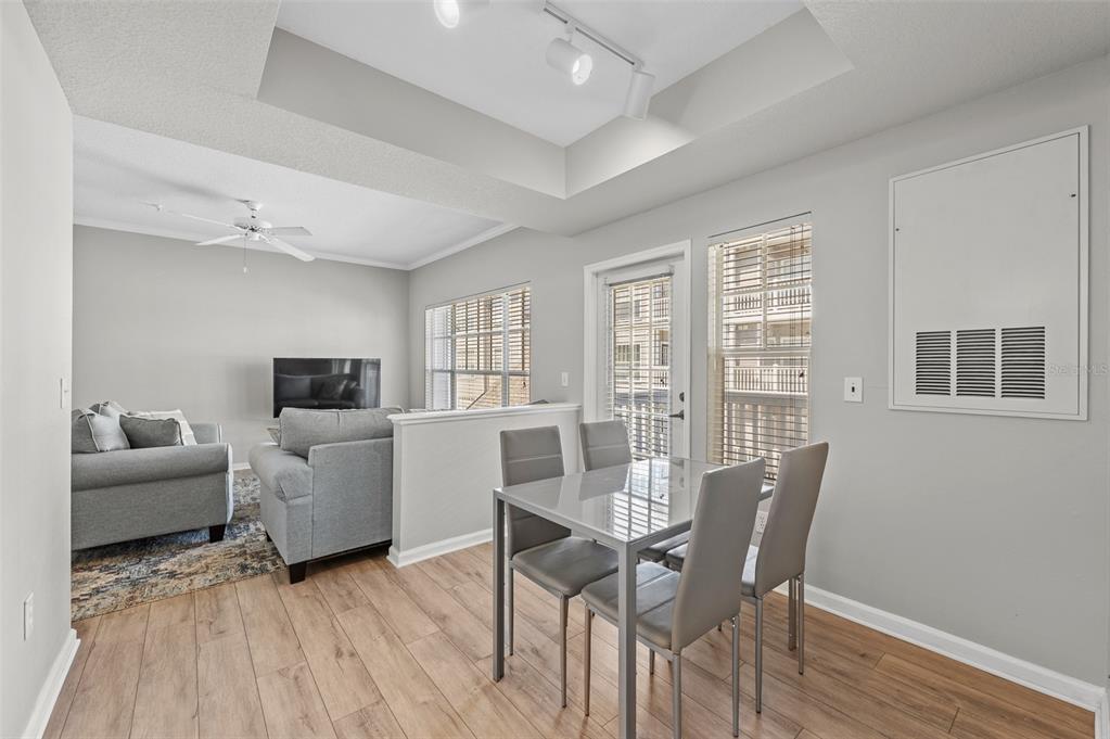 800 South Dakota Avenue, Unit 330 Tampa, FL 33606 - Photo 7 of 25 a view of a livingroom with furniture and a flat screen tv