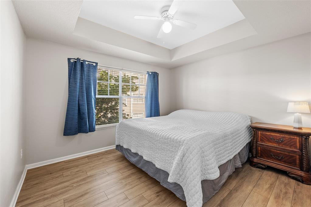 800 South Dakota Avenue, Unit 330 Tampa, FL 33606 - Photo 10 of 25 a spacious bedroom with a bed and a window