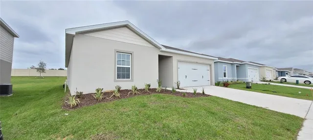 swimming pool view with a garden space
