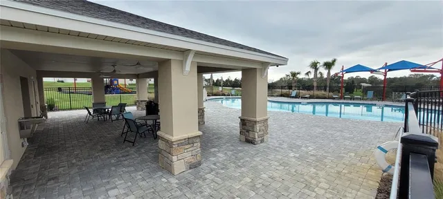 a view of a chairs and table in the patio