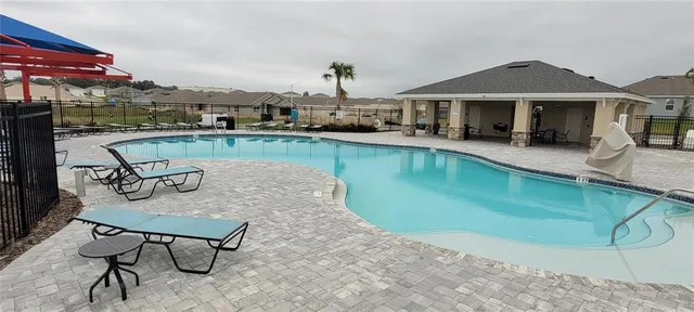 a view of a field with an trees