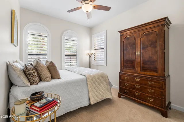 a bedroom with a bed and a dresser