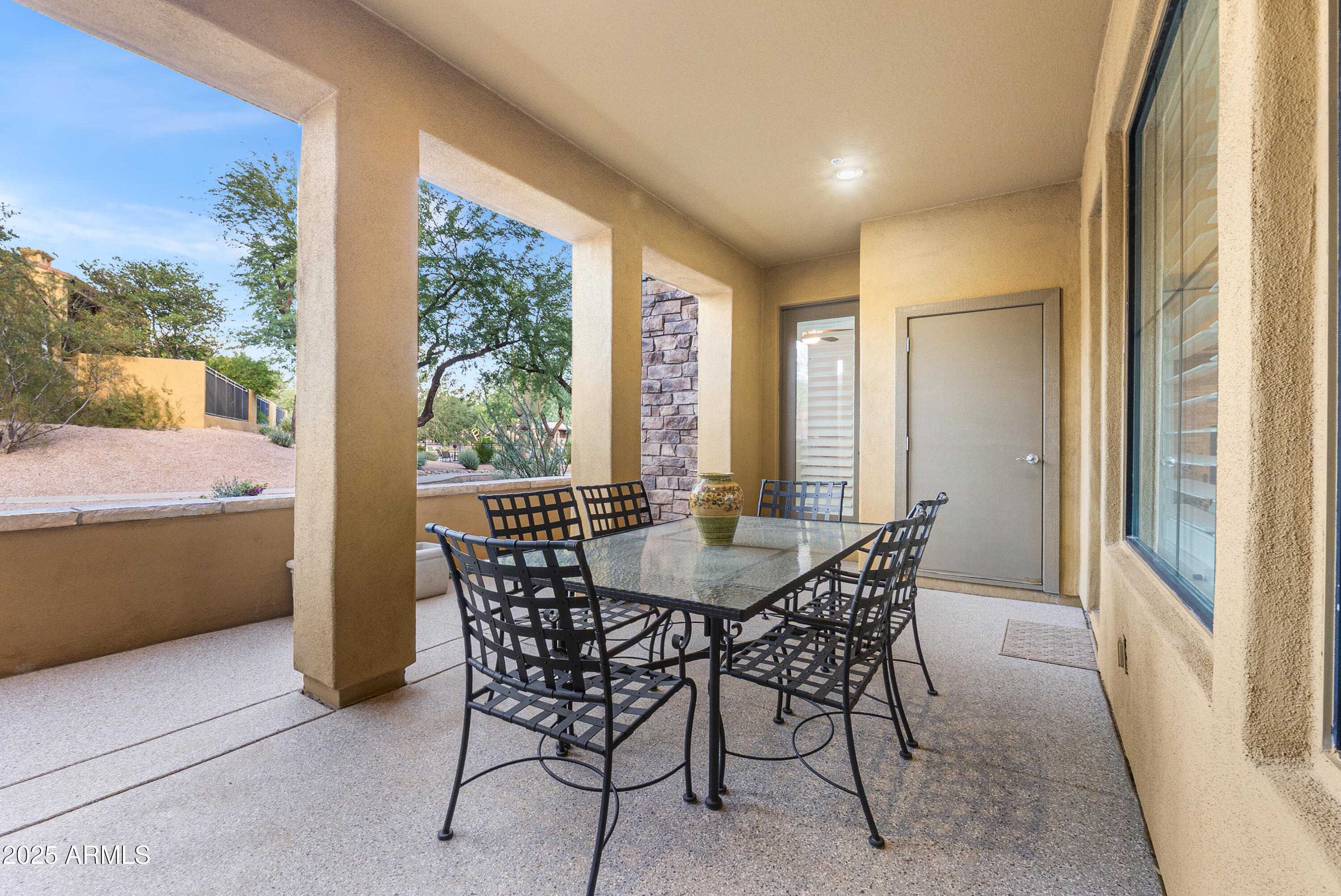 20750 North 87th Street, Unit 1050 Scottsdale, AZ 85255 - Photo 15 of 21 a view of a dining room with furniture large windows and wooden floor