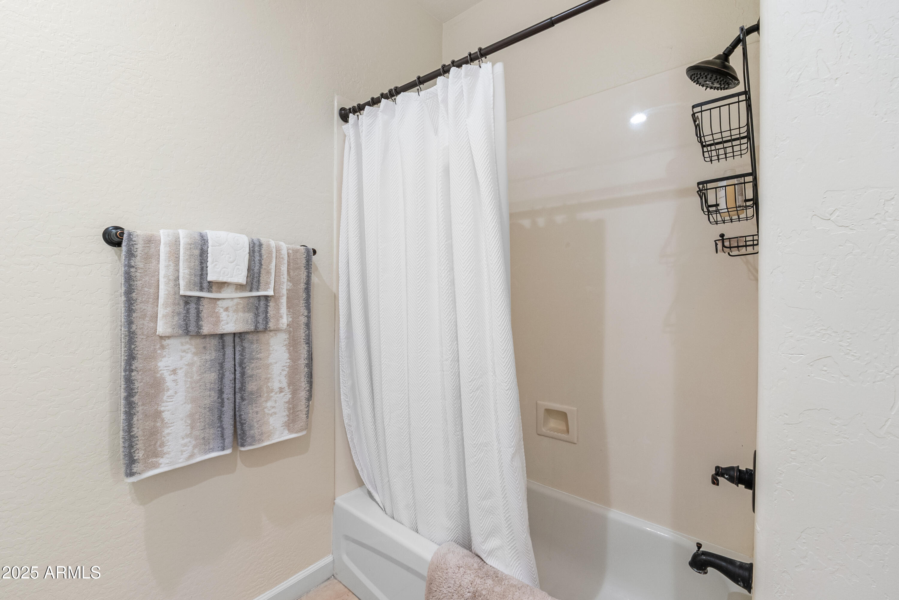20750 North 87th Street, Unit 1050 Scottsdale, AZ 85255 - Photo 16 of 21 a bathroom with a shower and a sink
