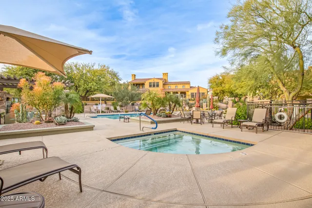 a view of a swimming pool with a patio