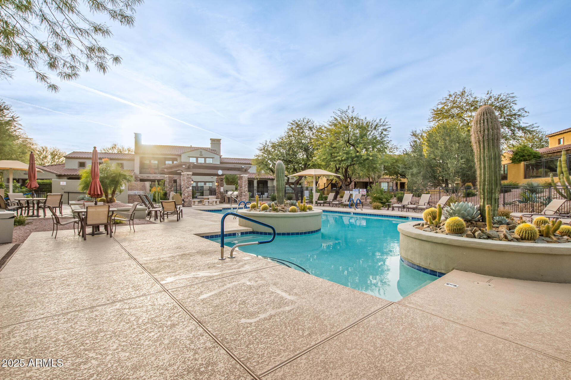 20750 North 87th Street, Unit 1050 Scottsdale, AZ 85255 - Photo 20 of 21 a view of a swimming pool and lounge chair