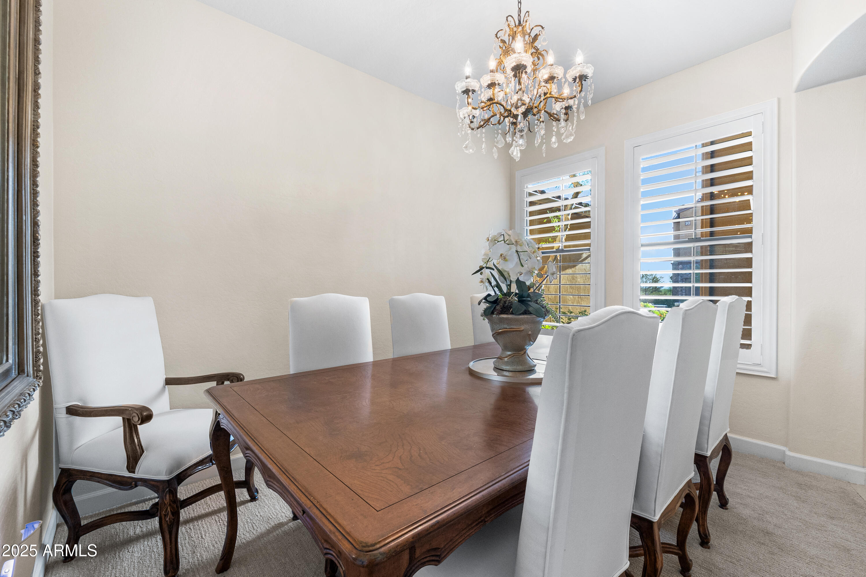 20750 North 87th Street, Unit 1050 Scottsdale, AZ 85255 - Photo 7 of 21 a view of a dining room with furniture and chandelier