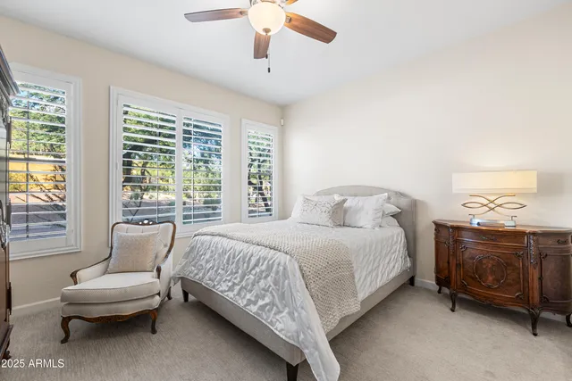 a bedroom with a bed and a couch