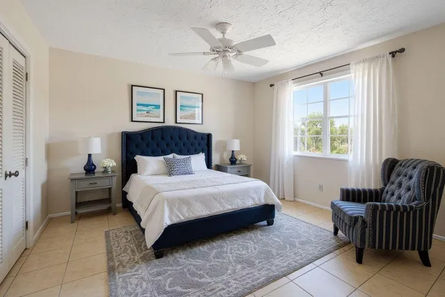 a bedroom with a bed and a couch