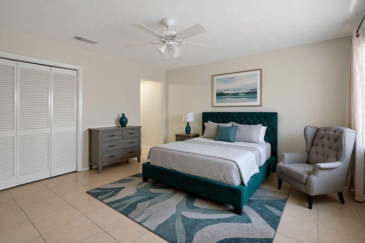 8638 Little River Road Houston, TX 77064 - Photo 10 of 14 a bedroom with a bed window and couch