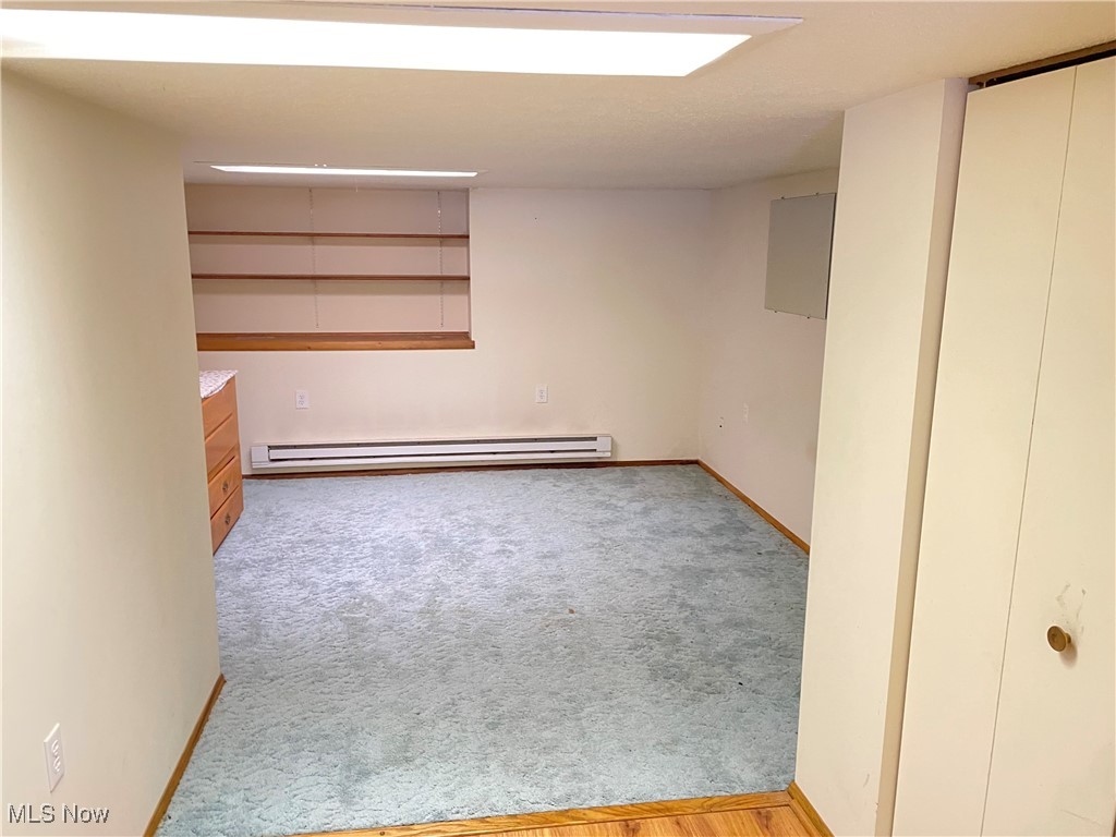 1381 Robb Road Conneaut, OH 44030 - Photo 31 of 50 Unfurnished room with light colored carpet and a baseboard heating unit
