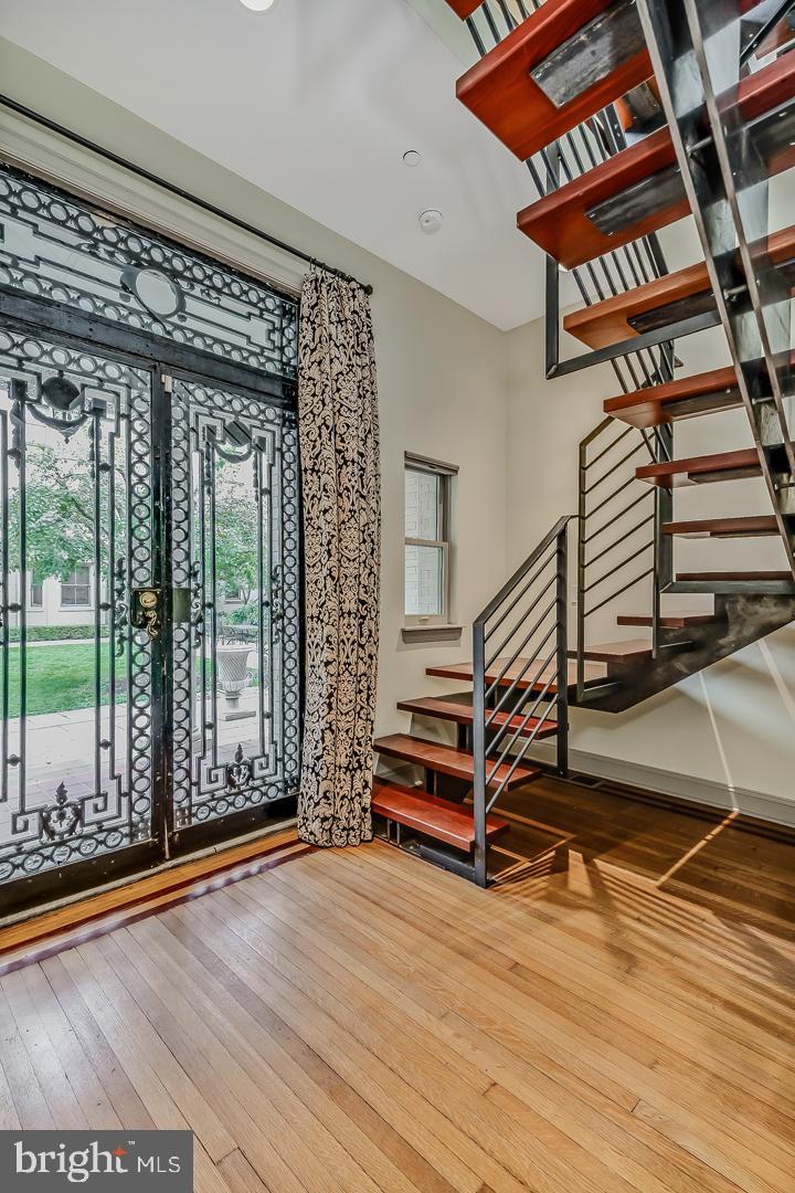 4200 Pine Street, Unit 108A Philadelphia, PA 19104 - Photo 17 of 49 a view of staircase with white walls and windows