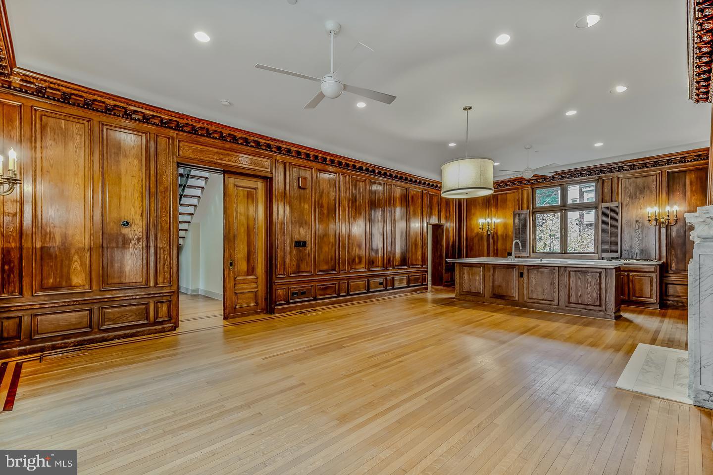 4200 Pine Street, Unit 108A Philadelphia, PA 19104 - Photo 21 of 49 an empty room with wooden floor and windows