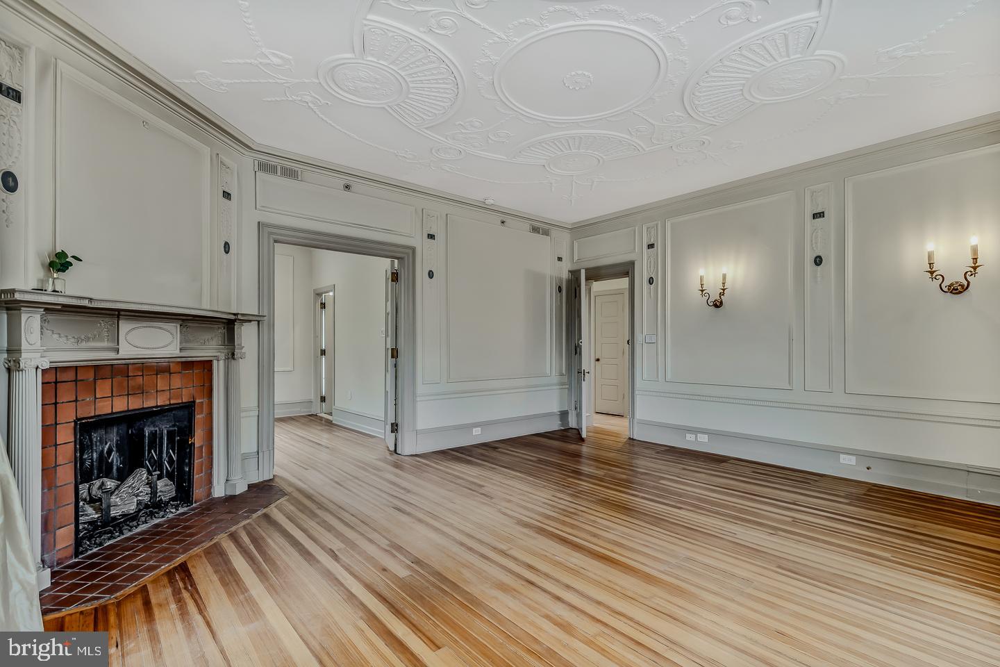 4200 Pine Street, Unit 108A Philadelphia, PA 19104 - Photo 28 of 49 a view of an empty room with wooden floor fireplace and a window