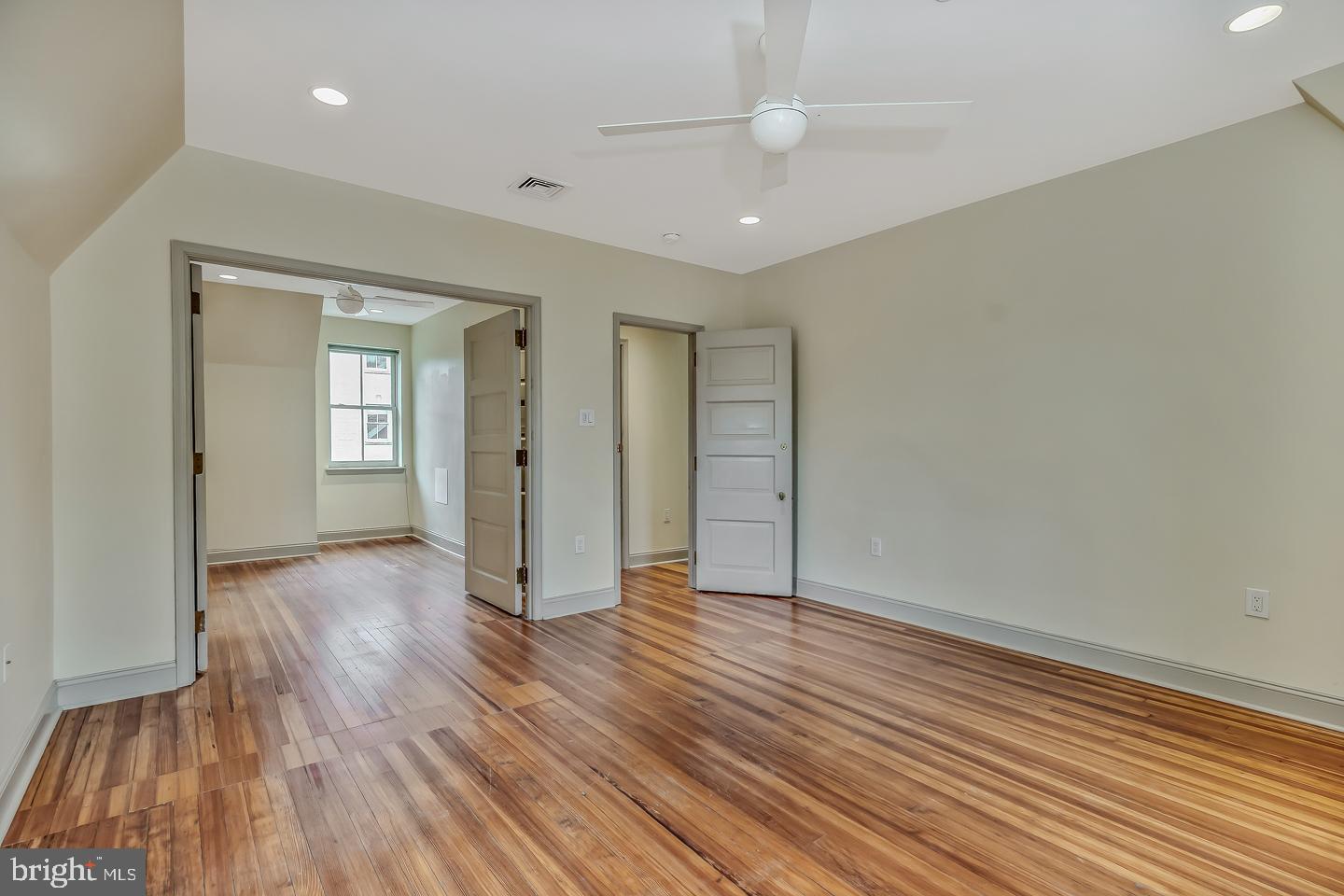 4200 Pine Street, Unit 108A Philadelphia, PA 19104 - Photo 38 of 49 wooden floor in an empty room with a window