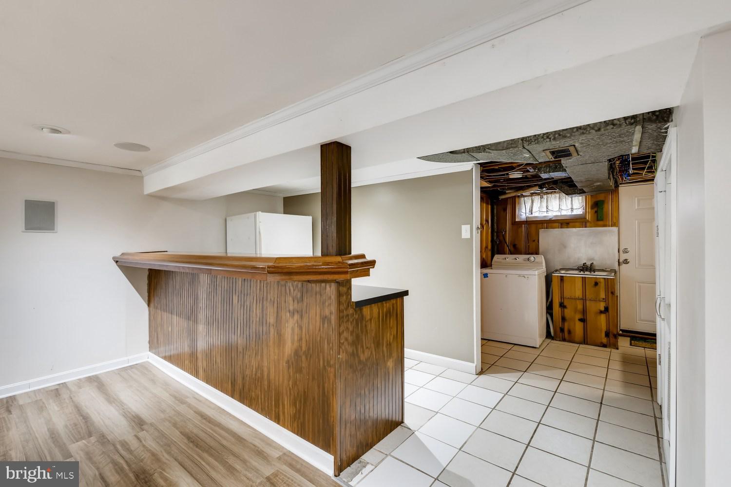 1717 Kennoway Road Towson, MD 21286 - Photo 22 of 31 Custom made built-in bar with countertop bar