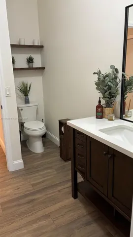 a bathroom with a sink and mirror