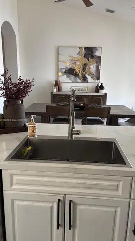 a view of utility room and kitchen