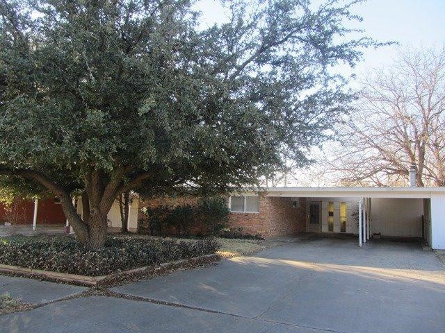 2513 47th Street Lubbock, TX 79413 - Photo 1 of 10 a front view of house with trees