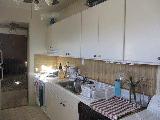 2513 47th Street Lubbock, TX 79413 - Photo 5 of 10 a kitchen with a sink and cabinets