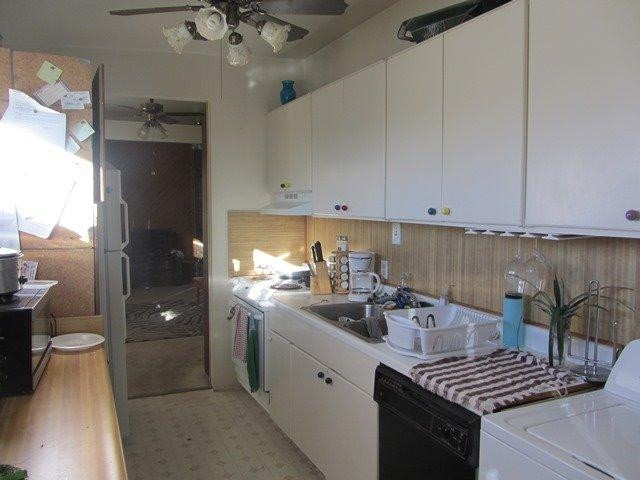 2513 47th Street Lubbock, TX 79413 - Photo 6 of 10 a kitchen with a sink and cabinets
