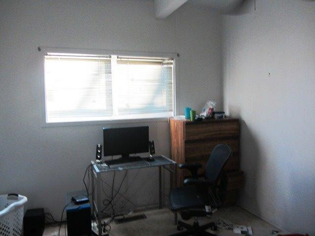 2513 47th Street Lubbock, TX 79413 - Photo 8 of 10 a view of a workspace with furniture and a window