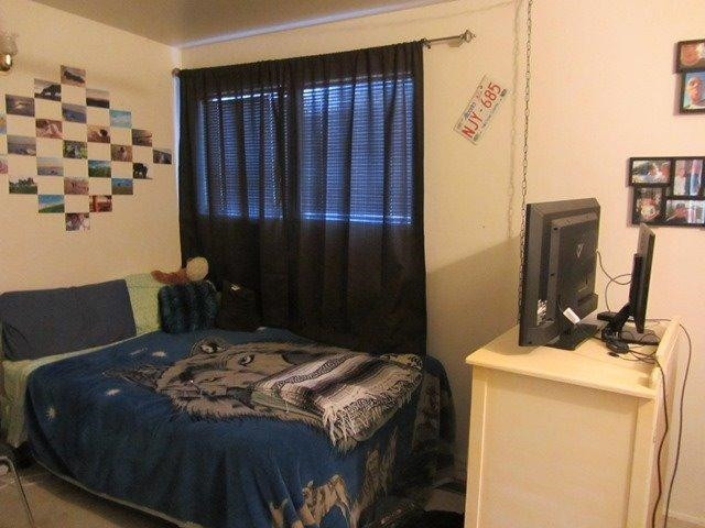 2513 47th Street Lubbock, TX 79413 - Photo 10 of 10 a bedroom with a bed and a flat screen tv