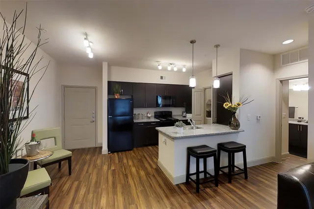 a kitchen with a table and chairs in it