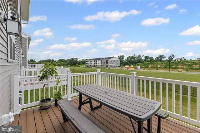 a view of a two chairs on the roof deck