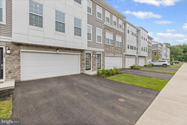 a view of a building with a yard