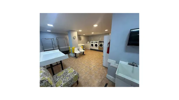 a living room with a sink and a window