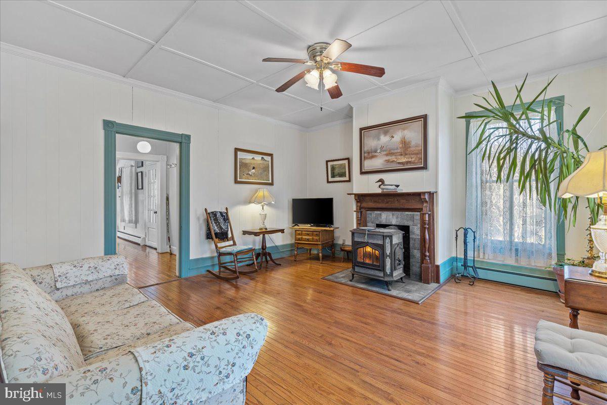 2485 Emmanuel Church Road Huntingtown, MD 20639 - Photo 12 of 67 Bright living room with wood stove