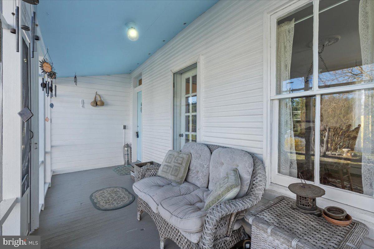 2485 Emmanuel Church Road Huntingtown, MD 20639 - Photo 27 of 67 Side screened porch