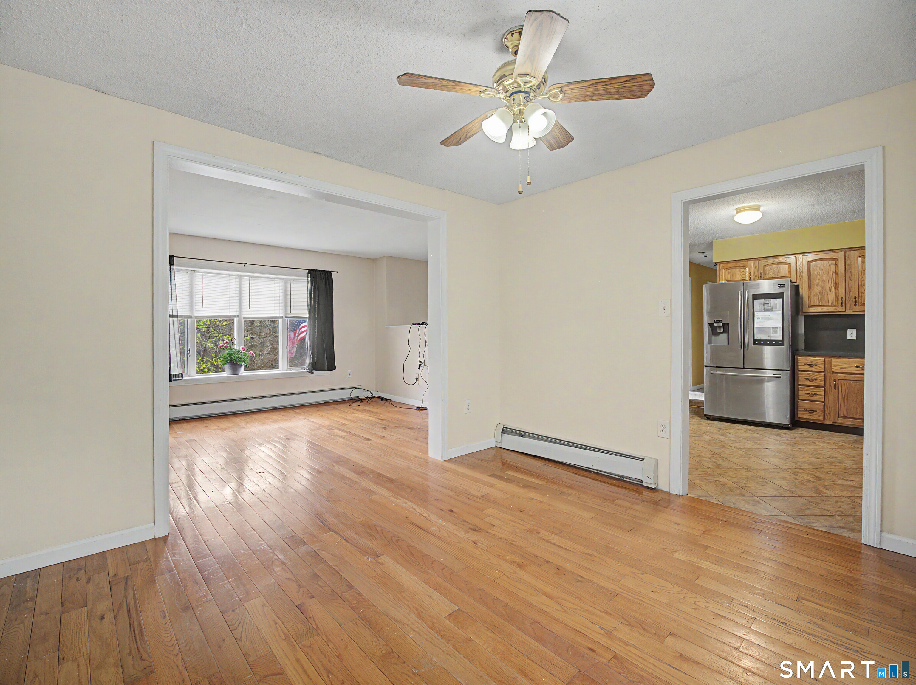 134 Roulin Street Torrington, CT 06790 - Photo 11 of 27 wooden floor in an empty room with a window